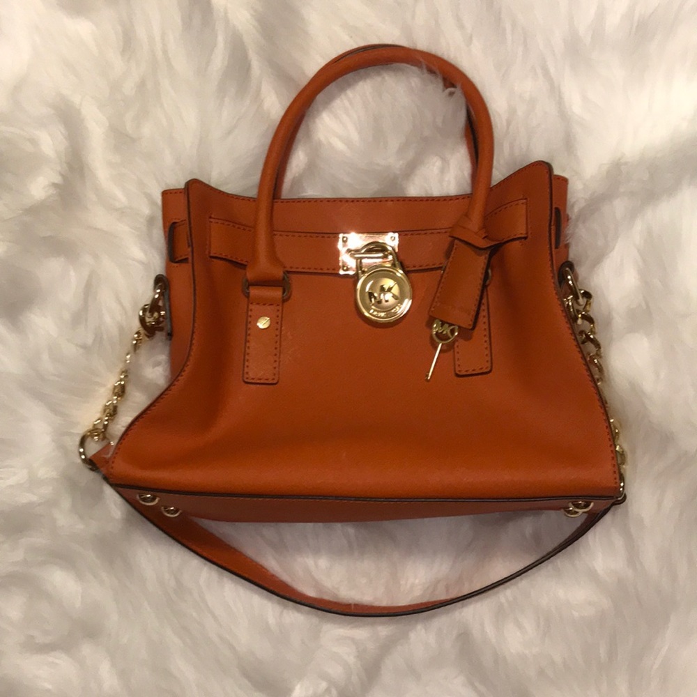 Orange Michael Kors Hamilton purse.